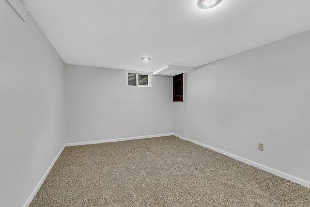 finished below grade area featuring carpet and baseboards