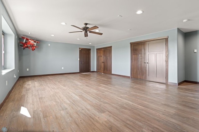 unfurnished living room featuring ceiling fan, light wood-type flooring, baseboards, and recessed lighting