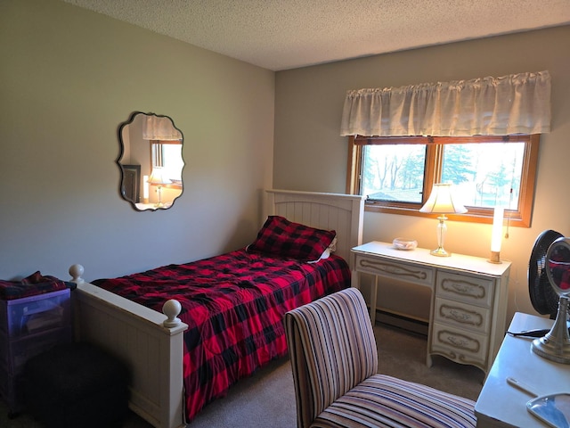 carpeted bedroom featuring a textured ceiling and baseboard heating
