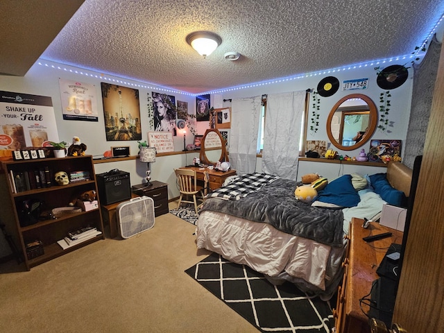 bedroom featuring carpet flooring and a textured ceiling
