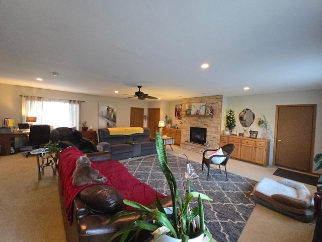 living area featuring a fireplace, carpet floors, and recessed lighting