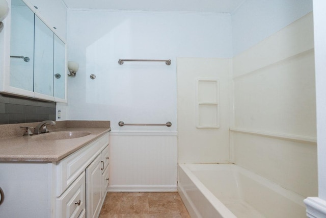 full bath featuring baseboards,  shower combination, and vanity