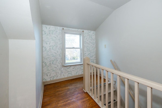 bonus room with vaulted ceiling, baseboards, wallpapered walls, and wood finished floors