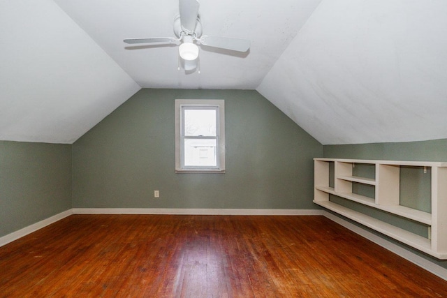 bonus room featuring vaulted ceiling, wood-type flooring, baseboards, and a ceiling fan