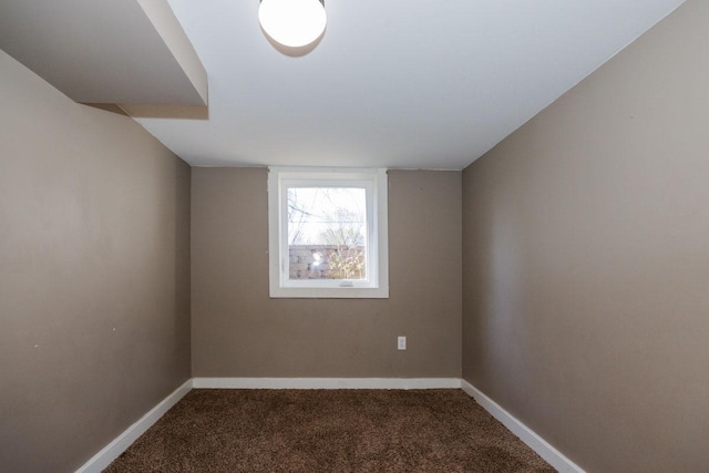 unfurnished room featuring carpet flooring and baseboards