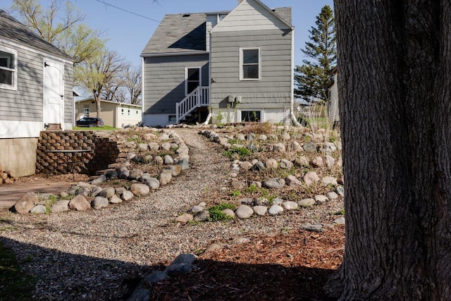 rear view of house with entry steps