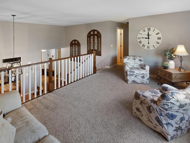 1535 148th Ln NE, Ham Lake, MN 55304 - sitting room featuring an upstairs landing, carpet floors, and baseboards