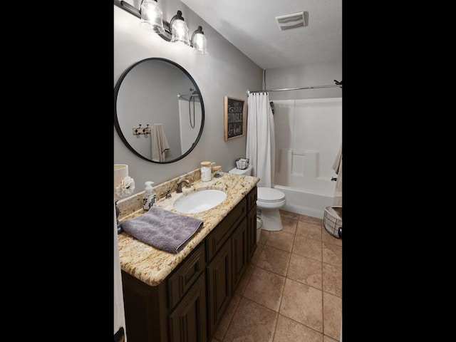 1535 148th Ln NE, Ham Lake, MN 55304 - full bath featuring toilet, shower / bath combo with shower curtain, vanity, a textured ceiling, and tile patterned floors