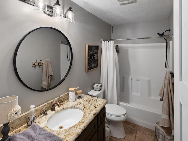 1535 148th Ln NE, Ham Lake, MN 55304 - full bath featuring a textured ceiling, toilet, tile patterned flooring, vanity, and shower / tub combo