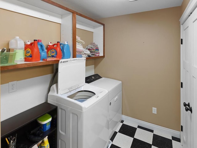 1535 148th Ln NE, Ham Lake, MN 55304 - washroom with tile patterned floors, independent washer and dryer, and baseboards