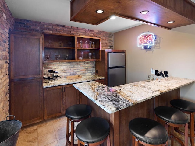 1535 148th Ln NE, Ham Lake, MN 55304 - indoor bar featuring brick wall, freestanding refrigerator, and recessed lighting