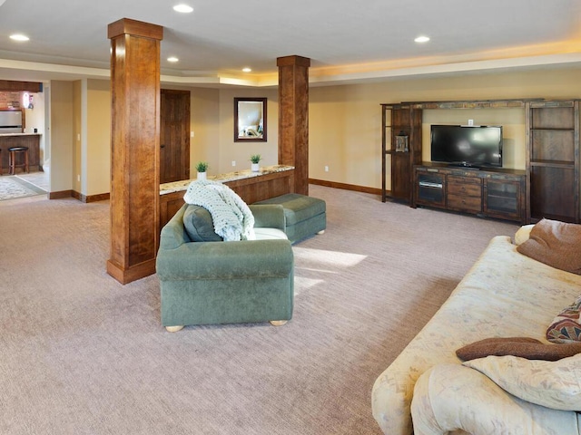 1535 148th Ln NE, Ham Lake, MN 55304 - carpeted living room with decorative columns, recessed lighting, baseboards, and a tray ceiling