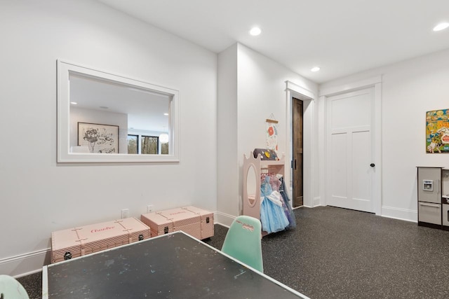 game room with baseboards and recessed lighting