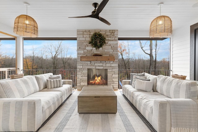 6480 Hawks Pointe Ln, Excelsior, MN 55331 - living room with a ceiling fan, an outdoor stone fireplace, and wood finished floors