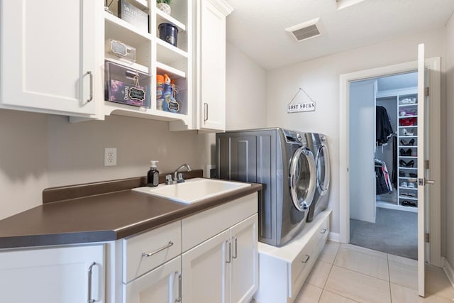 1105 Brown Rd S, Orono, MN 55391 - washroom featuring visible vents, washing machine and dryer, cabinet space, a sink, and light carpet