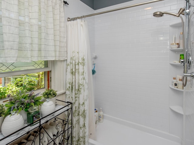 bathroom with shower / bath combination with curtain