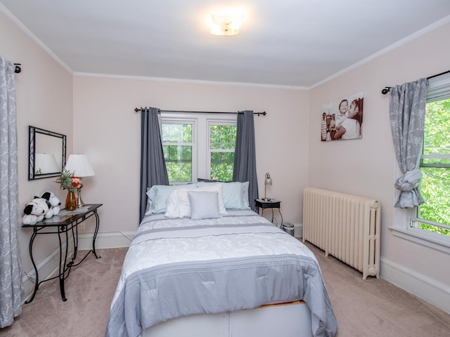 bedroom with radiator, light carpet, crown molding, and baseboards