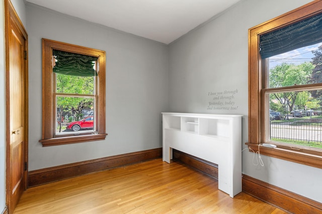 1520 Randolph Ave, Saint Paul, MN 55105 - unfurnished bedroom with light wood finished floors, crown molding, and baseboards