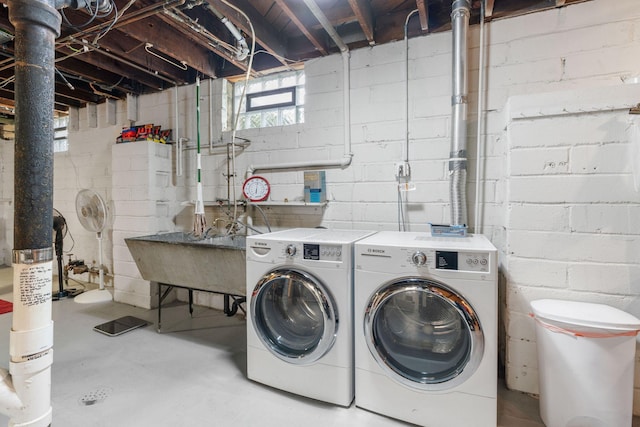 1520 Randolph Ave, Saint Paul, MN 55105 - laundry area featuring washer and clothes dryer and concrete block wall