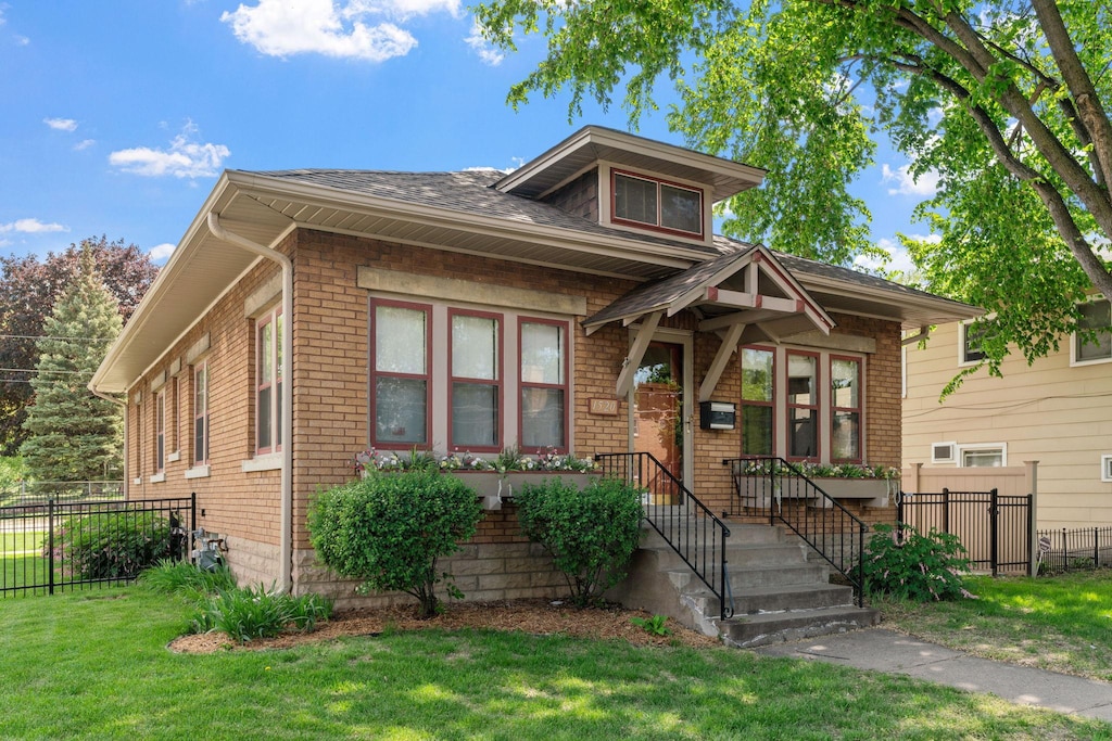 1520 Randolph Ave, Saint Paul, MN 55105 - view of front of house featuring brick siding and roof with shingles