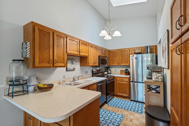 1060 Aston Cir, Burnsville, MN 55337 - kitchen with stainless steel appliances, high vaulted ceiling, a sink, a skylight, and light countertops