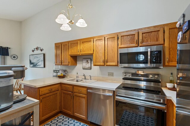 1060 Aston Cir, Burnsville, MN 55337 - kitchen with appliances with stainless steel finishes, a sink, a chandelier, light countertops, and high vaulted ceiling