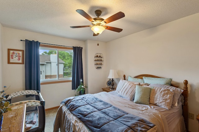 1060 Aston Cir, Burnsville, MN 55337 - bedroom with carpet, a textured ceiling, a ceiling fan, and baseboards