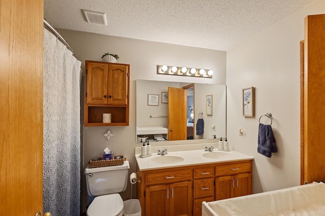 1060 Aston Cir, Burnsville, MN 55337 - bathroom with a textured ceiling, double vanity, toilet, and a shower with shower curtain
