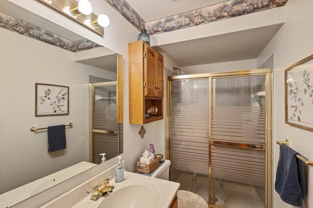 1060 Aston Cir, Burnsville, MN 55337 - full bath featuring a textured ceiling, a shower stall, vanity, and toilet