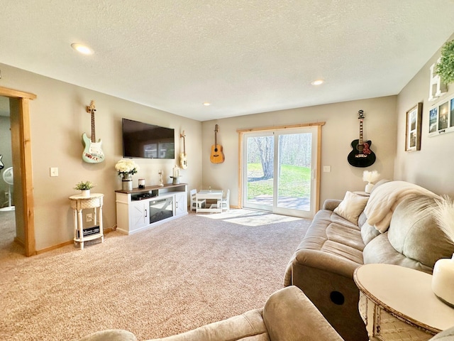 living area with carpet floors, recessed lighting, baseboards, and a textured ceiling