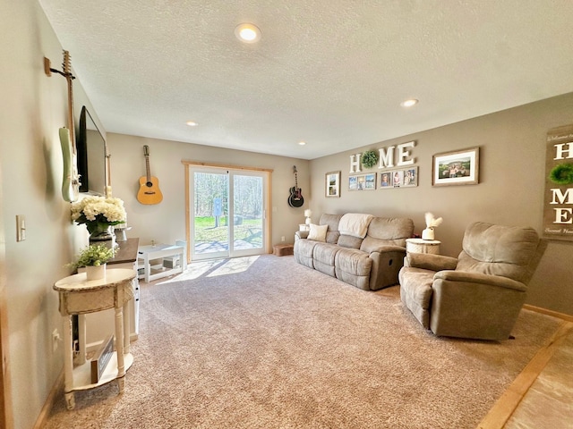 carpeted living area featuring a textured ceiling, recessed lighting, and baseboards