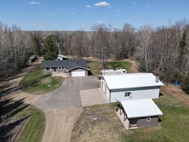view of subject property featuring a forest