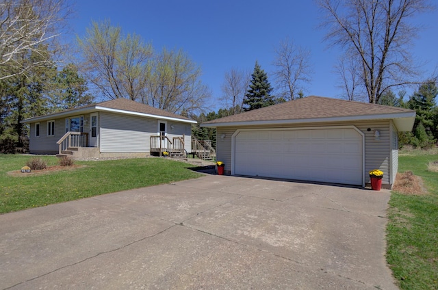 ranch-style house with a front lawn, an outdoor structure, and a detached garage