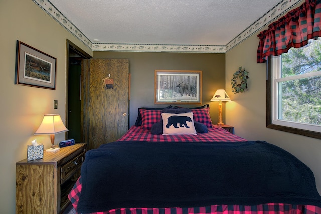 bedroom featuring a textured ceiling