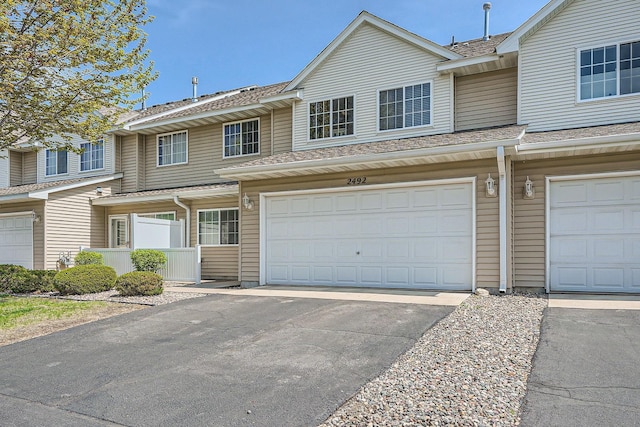 2492 Yellowstone Dr Unit 82, Hastings, MN 55033 - view of property featuring driveway, a garage, and a shingled roof