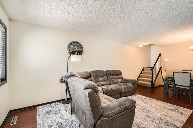 2492 Yellowstone Dr Unit 82, Hastings, MN 55033 - living area featuring a textured ceiling, dark wood-style floors, stairway, and baseboards