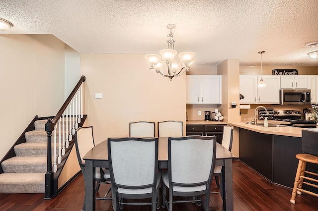 2492 Yellowstone Dr Unit 82, Hastings, MN 55033 - dining space with dark wood-style floors, a textured ceiling, a chandelier, and stairway