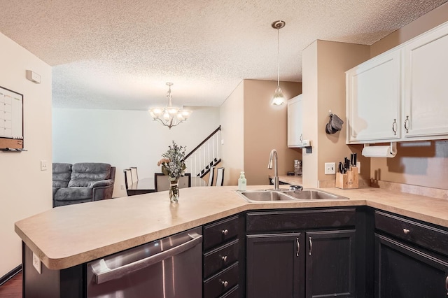 2492 Yellowstone Dr Unit 82, Hastings, MN 55033 - kitchen with dishwasher, a sink, a peninsula, light countertops, and a textured ceiling