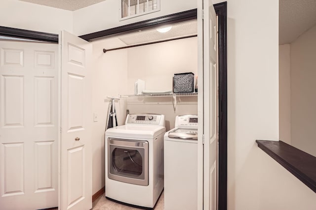 2492 Yellowstone Dr Unit 82, Hastings, MN 55033 - laundry room with separate washer and dryer and a textured ceiling
