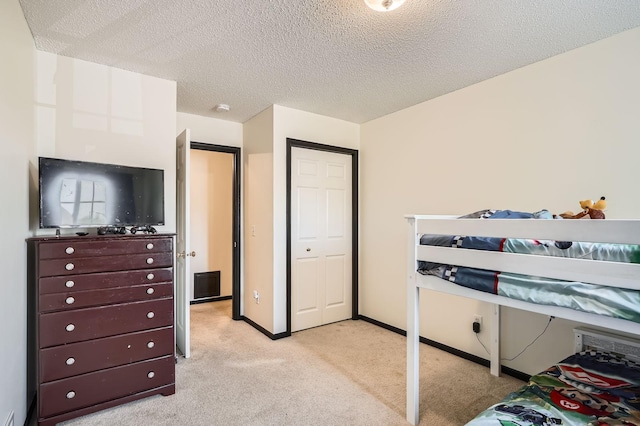 2492 Yellowstone Dr Unit 82, Hastings, MN 55033 - bedroom featuring light colored carpet, a textured ceiling, and baseboards