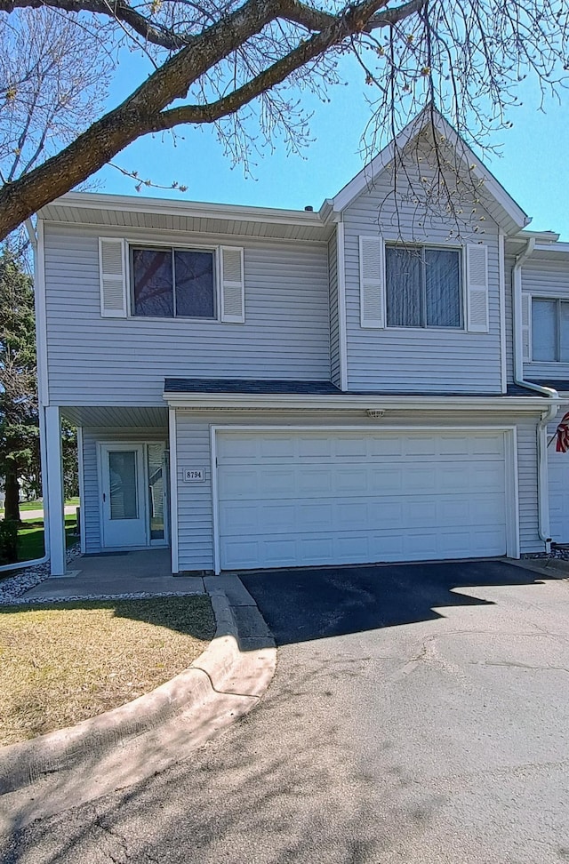view of front facade with an attached garage and driveway