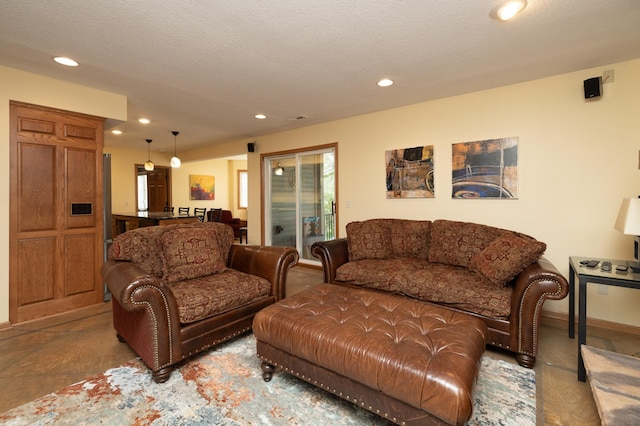 living area with recessed lighting and baseboards