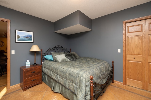 bedroom featuring baseboards