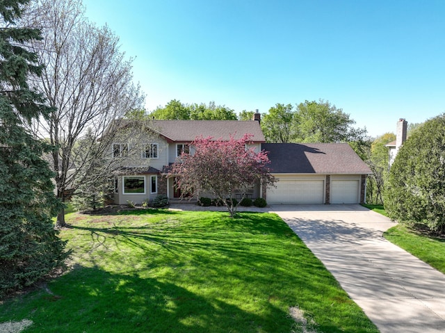 traditional-style home featuring concrete driveway, a garage, a chimney, and a front lawn