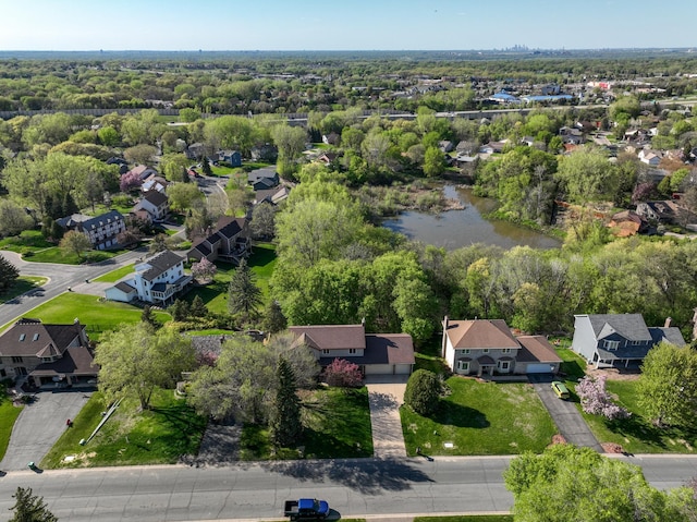 aerial perspective of suburban area with a large body of water