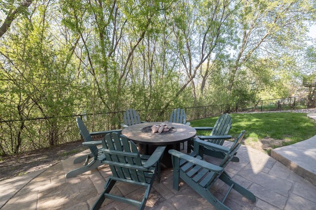 view of patio with an outdoor fire pit and outdoor dining space