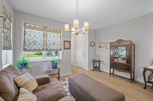 11062 16th St NE, Saint Michael, MN 55376 - living room featuring a chandelier, light wood-style floors, and baseboards