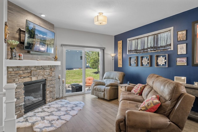 11062 16th St NE, Saint Michael, MN 55376 - living area featuring wood-type flooring and a stone fireplace
