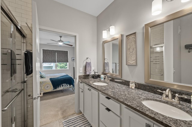 11062 16th St NE, Saint Michael, MN 55376 - ensuite bathroom with a shower stall, double vanity, a ceiling fan, and tile patterned flooring