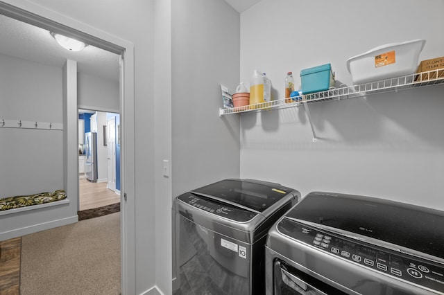 11062 16th St NE, Saint Michael, MN 55376 - washroom featuring washing machine and clothes dryer, baseboards, and carpet floors